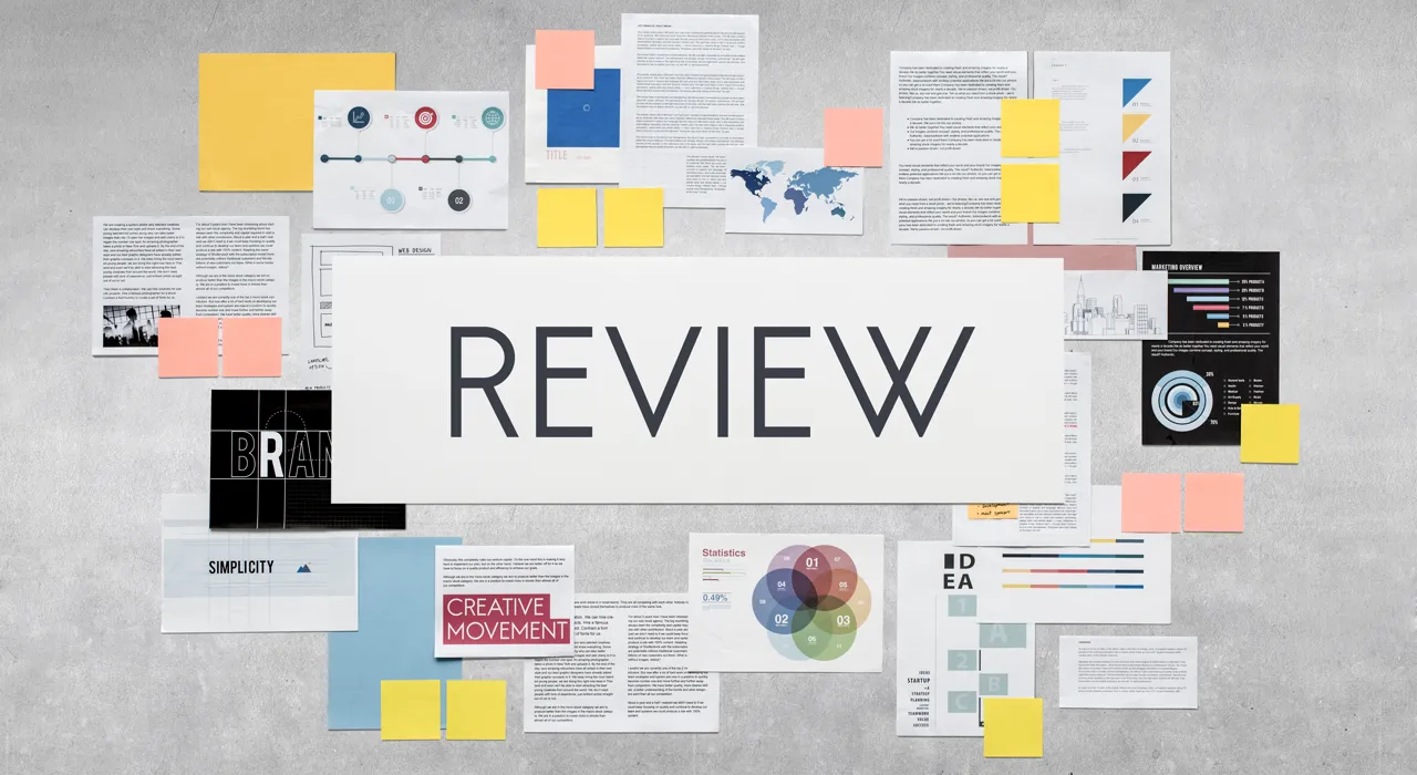 Marketing strategy documents and charts spread across a desk.