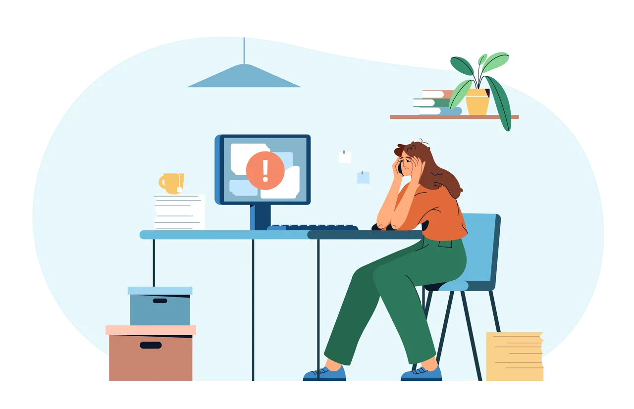 A tired office worker slumped at her desk under a nearly empty battery